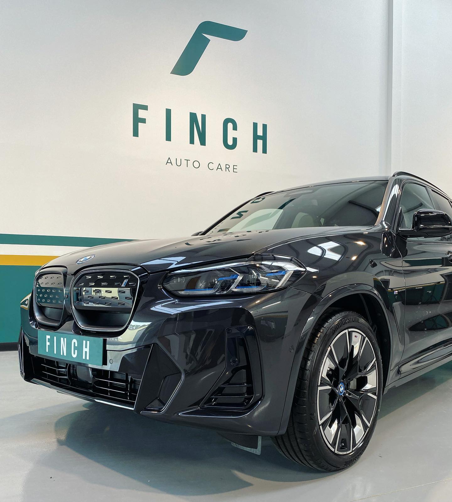 A black luxury suv on display at finch auto care.